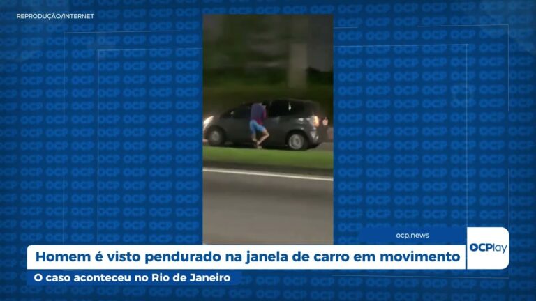 Homem é visto pendurado na janela de carro em movimento